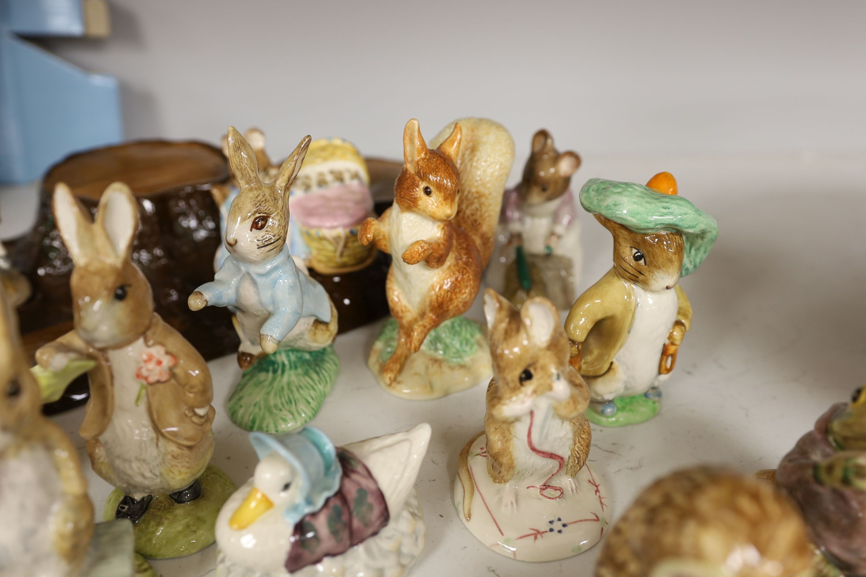 A collection Beswick, Royal Albert and Border Fine Arts Beatrix Potter figures